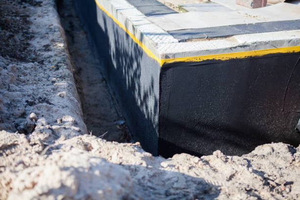 Professional Waterproofing technician working in Brownsville, WI